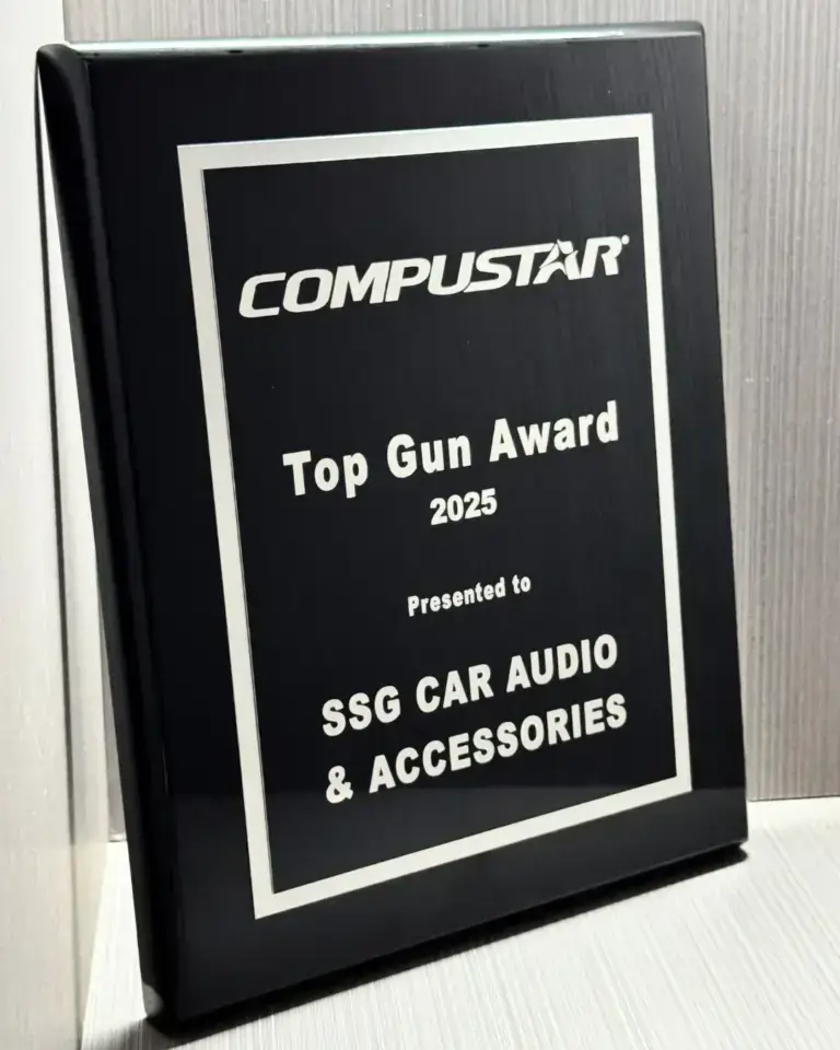 SSG Car Audio & Accessories team holding the 2025 Compustar Top Gun Award by Firstech, celebrating excellence in remote start, car alarms, vehicle security, and high-quality installations in Fort Lauderdale, Florida.